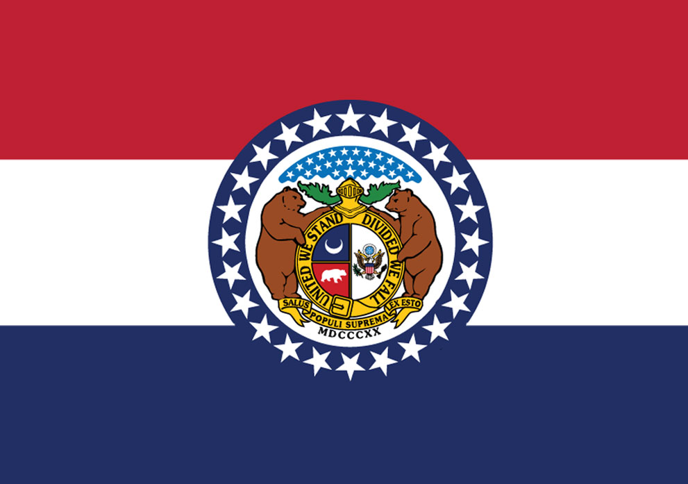 Missouri state flag featuring red, white, and blue stripes, with a central seal depicting two bears, a shield, and stars, symbolizing Kinetic Builders Corp's service area and commitment to regional construction projects.