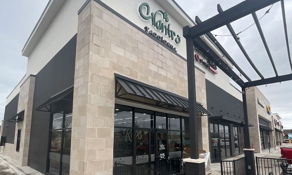 Cilantro's Taco Bar exterior in Celina, TX, featuring modern design elements, large windows, and brand signage, highlighting the fast-casual dining concept.
