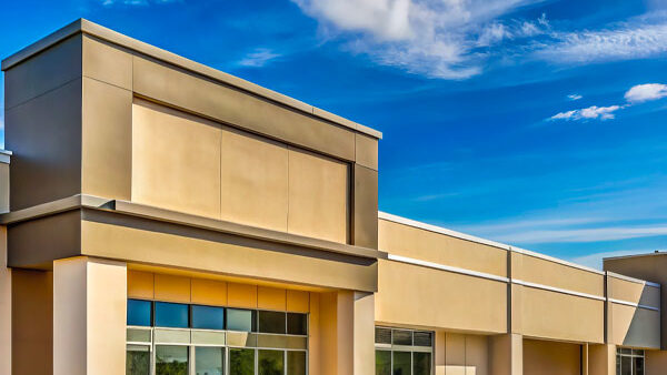 Modern commercial building exterior showcasing clean lines and large windows, representing Kinetic Builders' expertise in restaurant construction and renovations.
